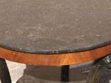 a small table with a marble top and a wooden base