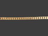 un bracelet à chaîne en or avec un fermoir sur fond noir