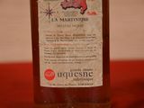 a bottle of liquor sitting on a table with a map on it