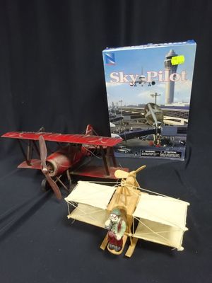 a toy airplane and a book on a table