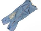 denim pants with red stitching and buttons on a white background