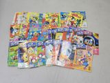 a lot of comic books that are on the table