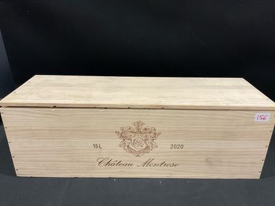 a wooden box with a crest on the lid