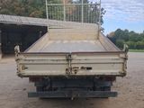 an image of a flat bed truck parked in a lot
