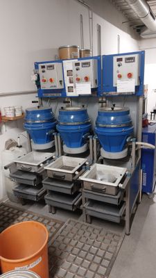 a room filled with buckets and other items in it