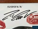 a picture of a signed autograph of a sports car