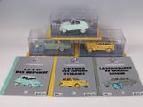 four different models of cars on display in a display case