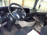 a picture of the inside of a vehicle with a steering wheel