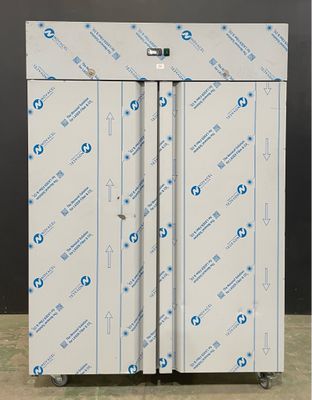 an image of a white refrigerator with a blue and white sticker on it