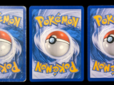 three cards with a picture of a pokemon figure on them
