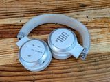 a pair of headphones sitting on a wooden table