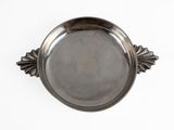 an image of a silver plate with a decorative design on it