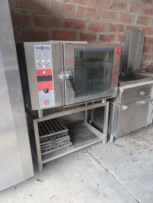 two ovens sitting next to each other on a sidewalk