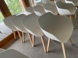 a lot of chairs that are sitting in a room