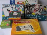 a pile of board games on a white table