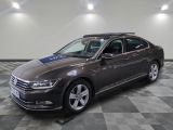 the volkswagen passat is parked in a large room with a checkered floor