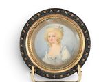 a picture of a woman in a blue dress on a plate