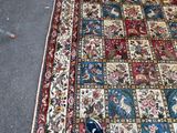 a person standing on a rug with their shoes on