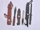 several different types of knives are lined up on a white surface