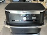 an image of a kitchen appliance sitting on a counter