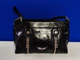black leather purse with zippers and zippers on it