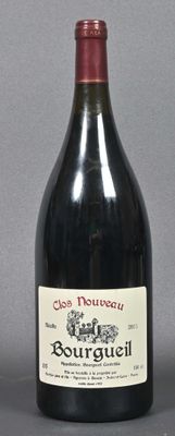 a bottle of wine that is sitting on a table