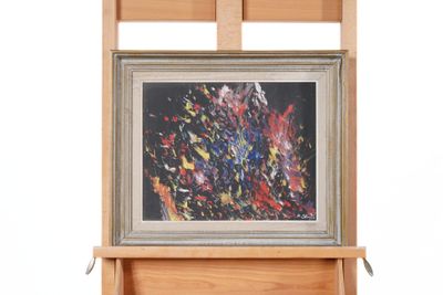 a picture of a painting hanging on a wooden easel