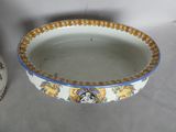 a white bowl with a blue border and a yellow and white bowl with a blue border