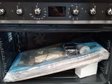 a black oven with a clear plastic cover on it