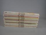 a stack of vinyl records stacked on top of each other