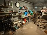 a room filled with lots of items and a clock on the wall