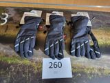 three pairs of ski gloves are on display in a display case