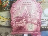 a pink cake with a pink frosting on top of it
