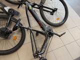 several bikes are lined up on the floor in a store