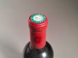 a bottle of wine that is sitting on a table