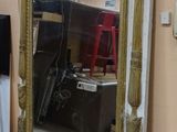 a mirror that is sitting on the floor in a room