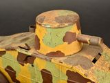 a toy tank that has a camouflage pattern on it