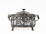 an antique silver plated box with a glass cover on a white background