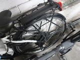 a bicycle that is parked next to a wall