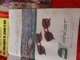 a lot of magazines and sunglasses on the table