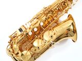 an image of a gold saxophone on a white background