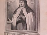 an old book with a picture of a nun holding a cross