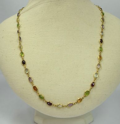 a close up of a necklace on a mannequin mannequin