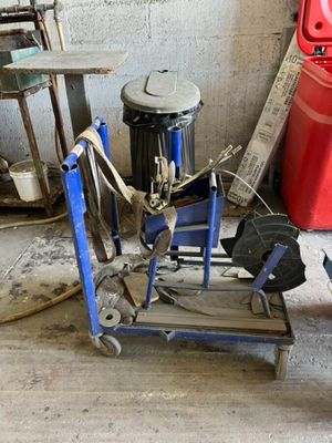 a blue cart with tools on it in a garage