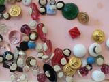 a lot of buttons and buttons on a pink surface