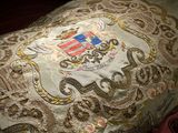 a pillow with a picture of a coat of arms on it