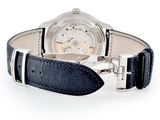 a watch that is sitting on a black leather strap