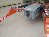 an image of a crane that is parked in a parking lot