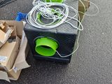 a box of wires and a box of boxes on the ground