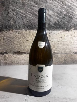 a bottle of wine that is sitting on a table